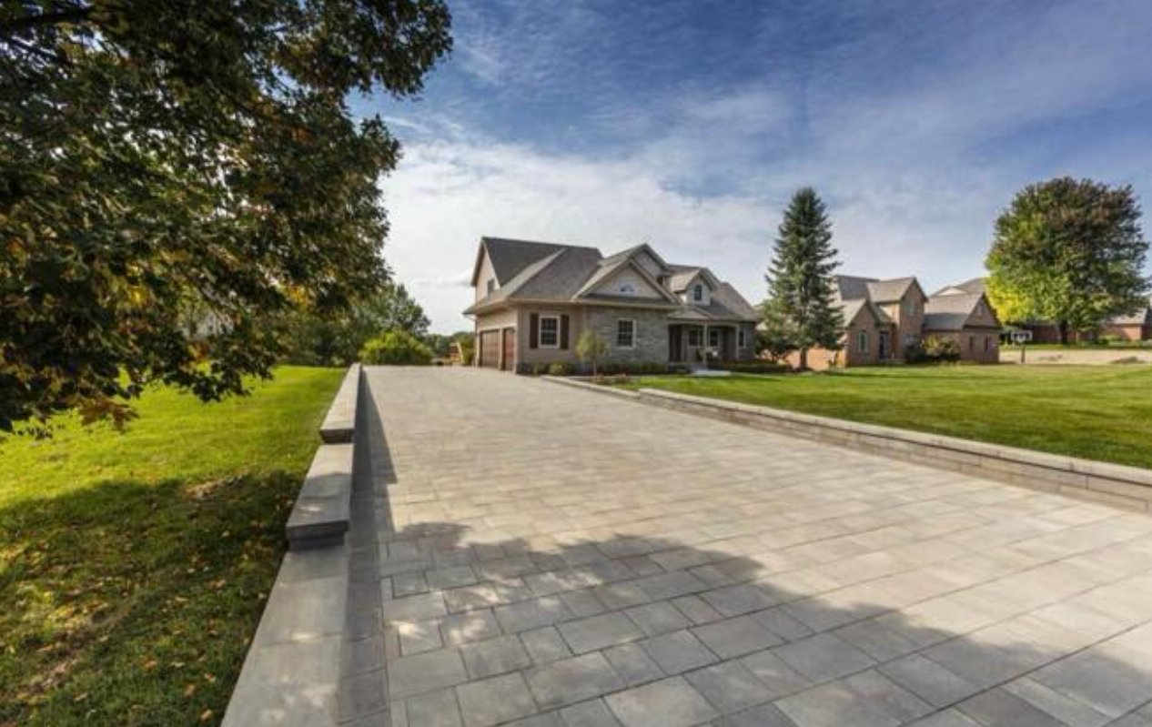 Custom brick paver driveway by Nelligan's Outdoor Services