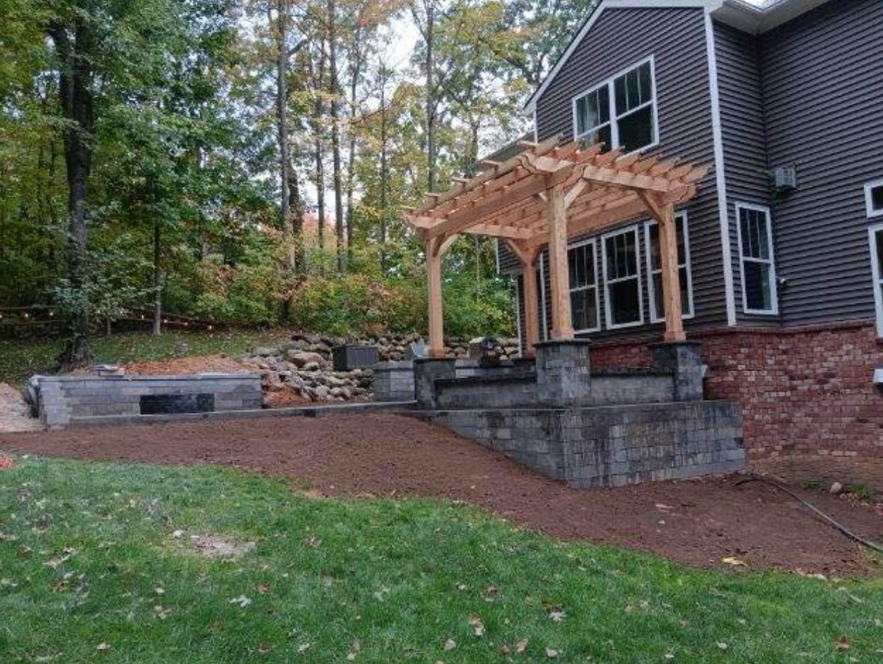 Custom pergola and patio by Nelligan's