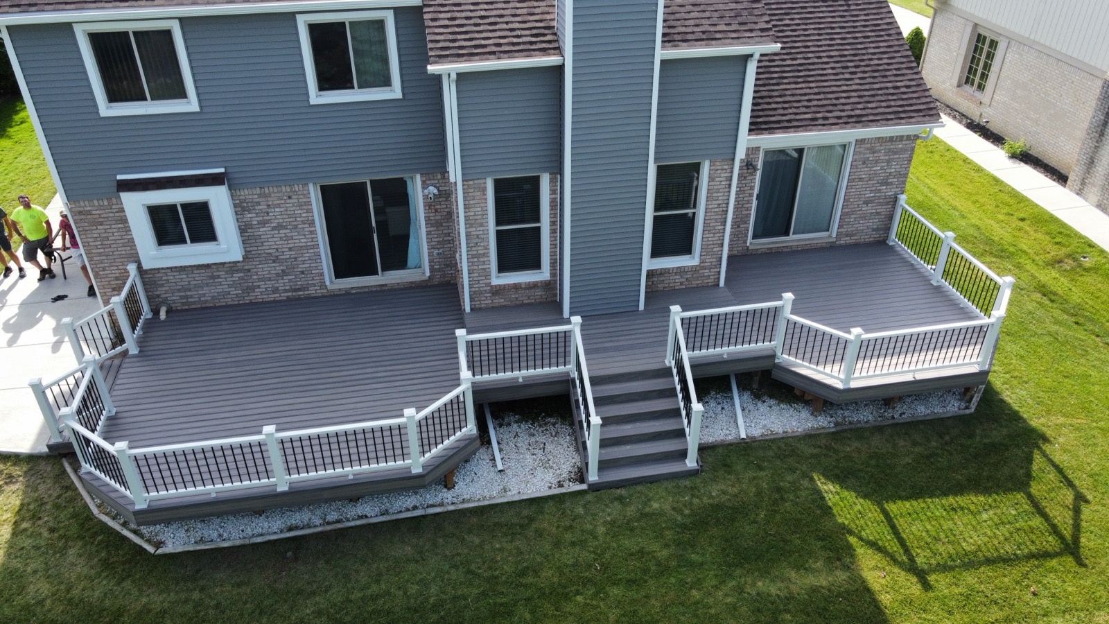 Multi-level composite deck with white railings — aerial view