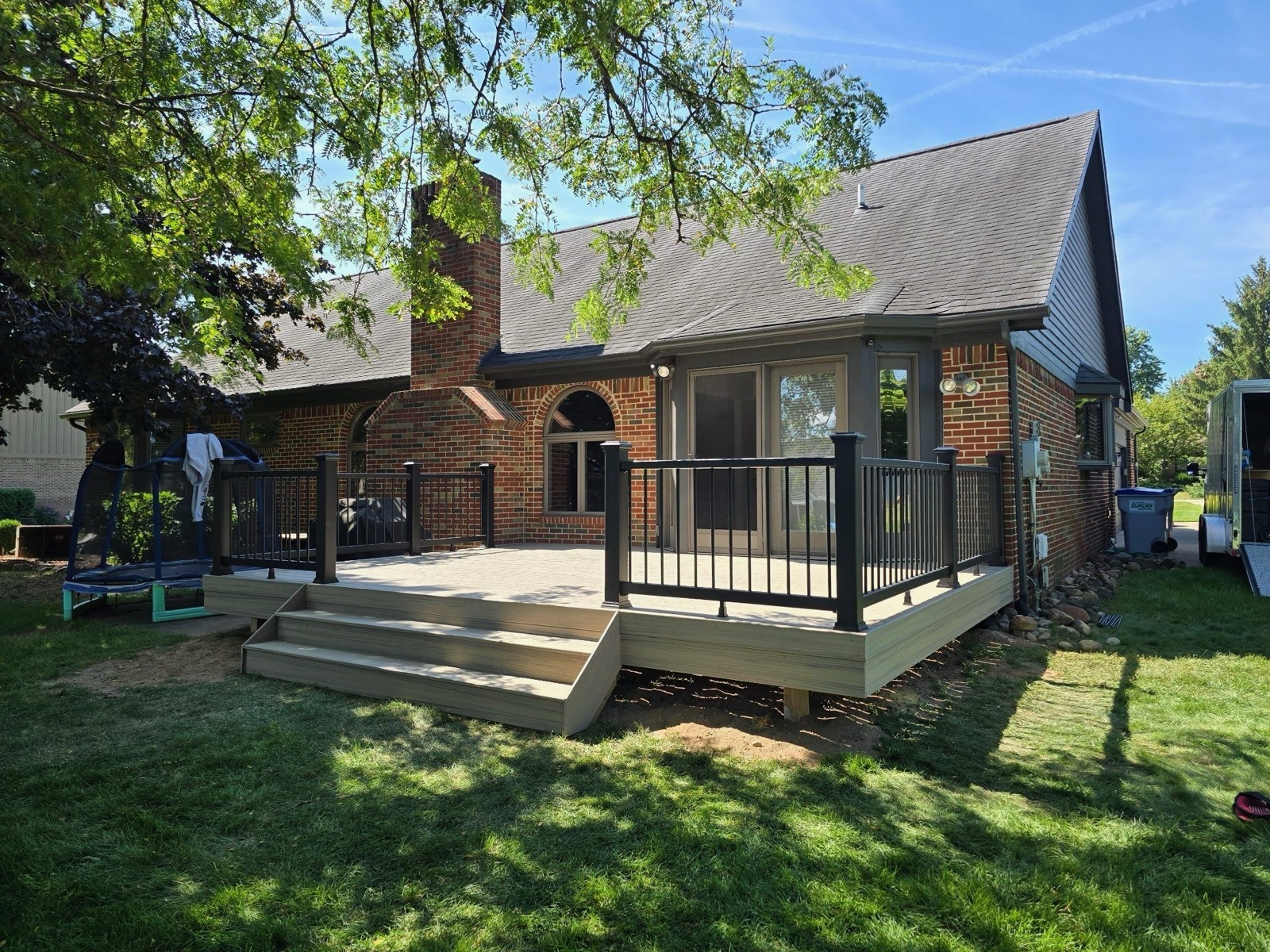 Custom deck addition on brick home