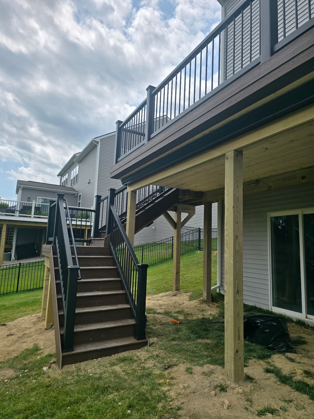 Elevated deck with stairs and black railings