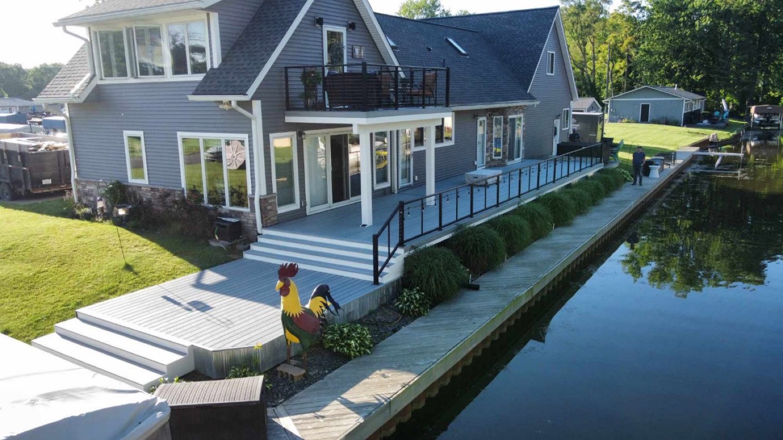 Lakefront deck with upper balcony
