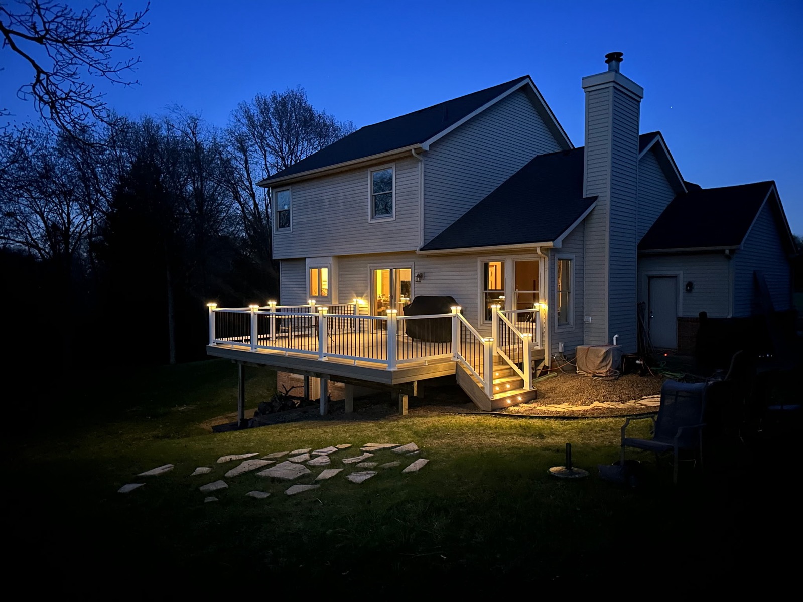 Custom deck with built-in lighting at night